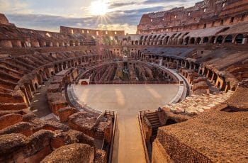 Scenic view of Roman Colosseum interior at sunset, Rome Italy