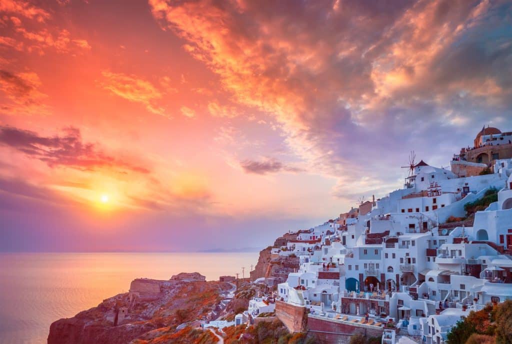 Sunset over Oia town on Santorini island in summer