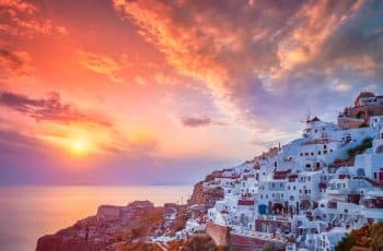 Sunset over Oia town on Santorini island in summer